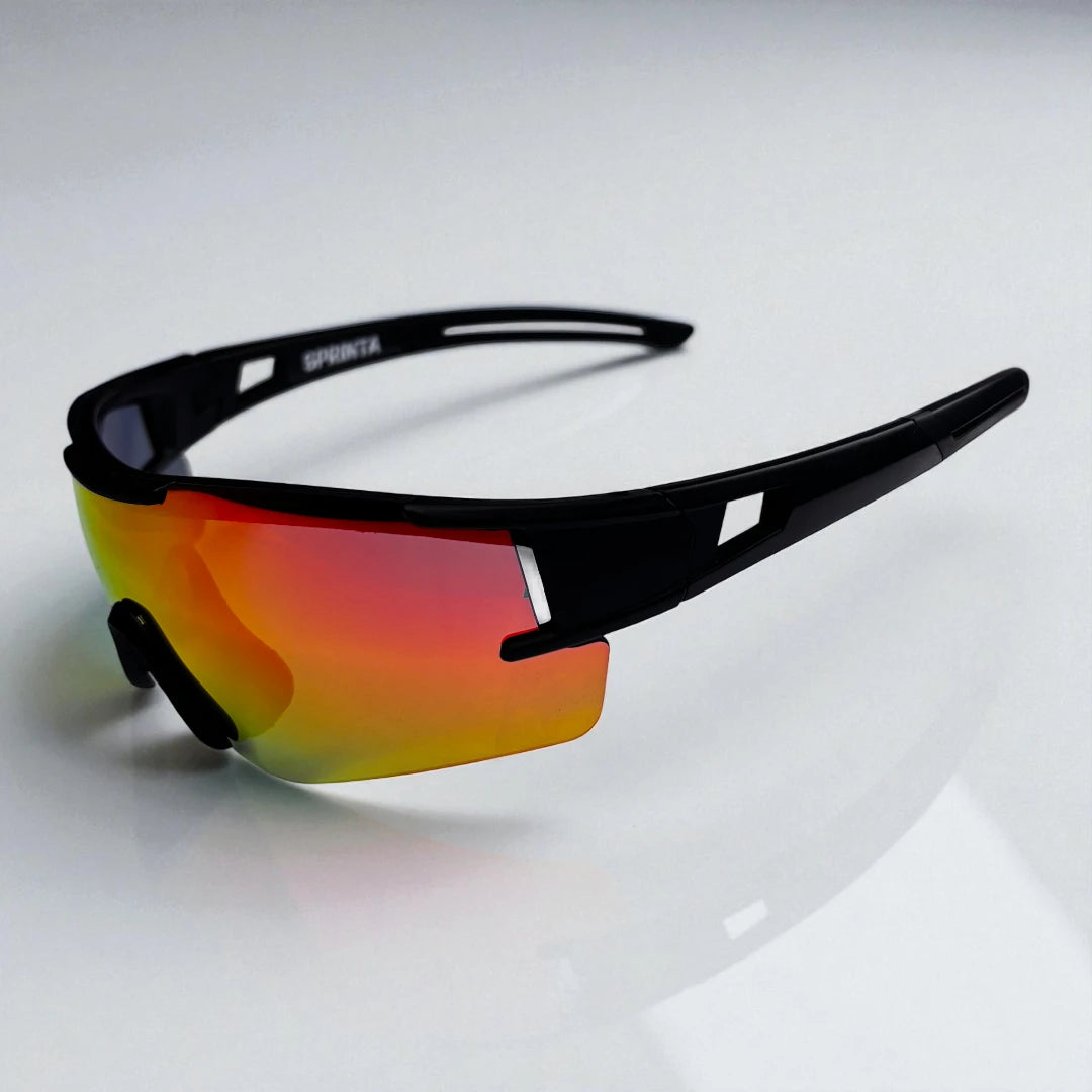 Sprinta Performance løbebriller set fra siden – elegant og let stel med orange spejllinse, skabt til løb, motion og aktiv hverdag med perfekt pasform.